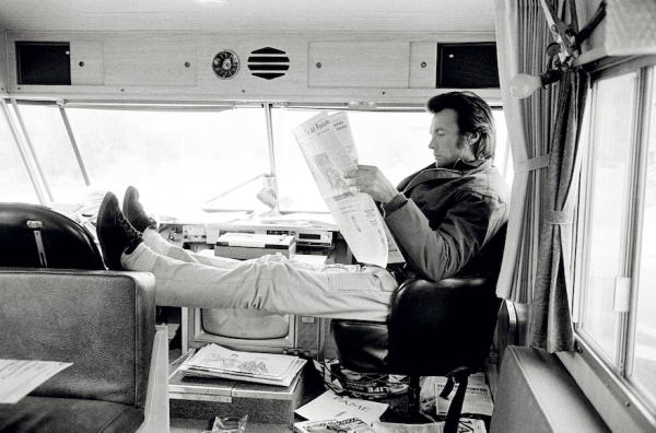 Clint Eastwood reading newspaper